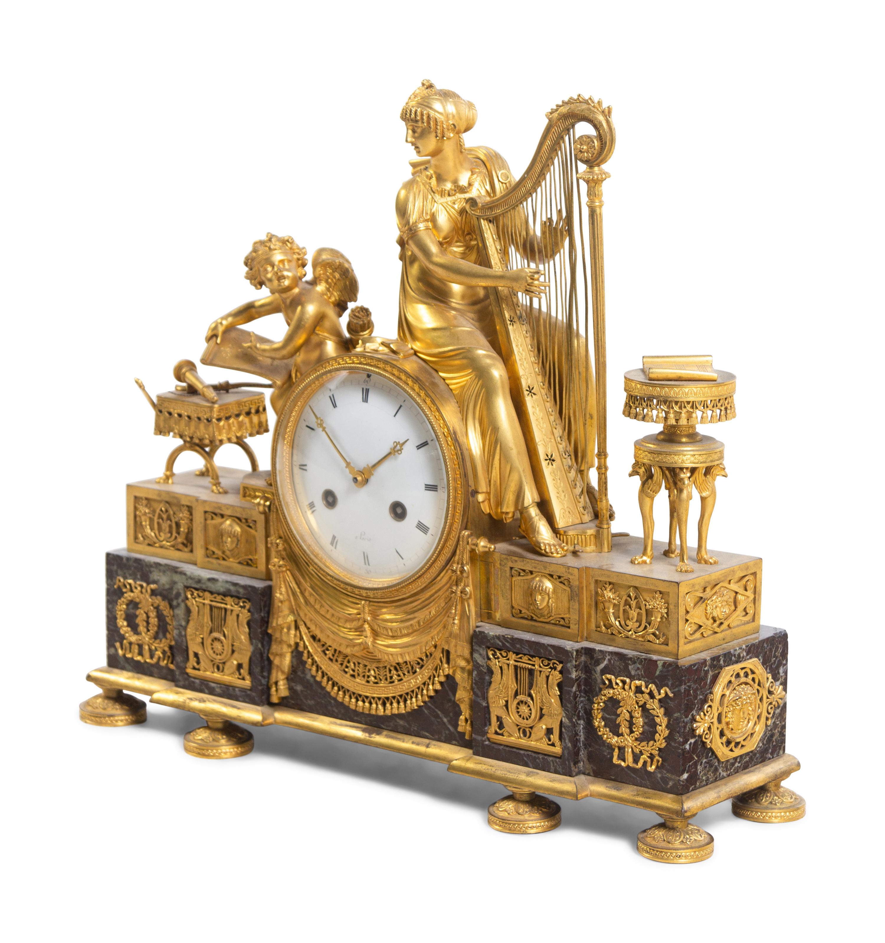 An Empire Gilt Bronze and Marble Figural Mantel Clock