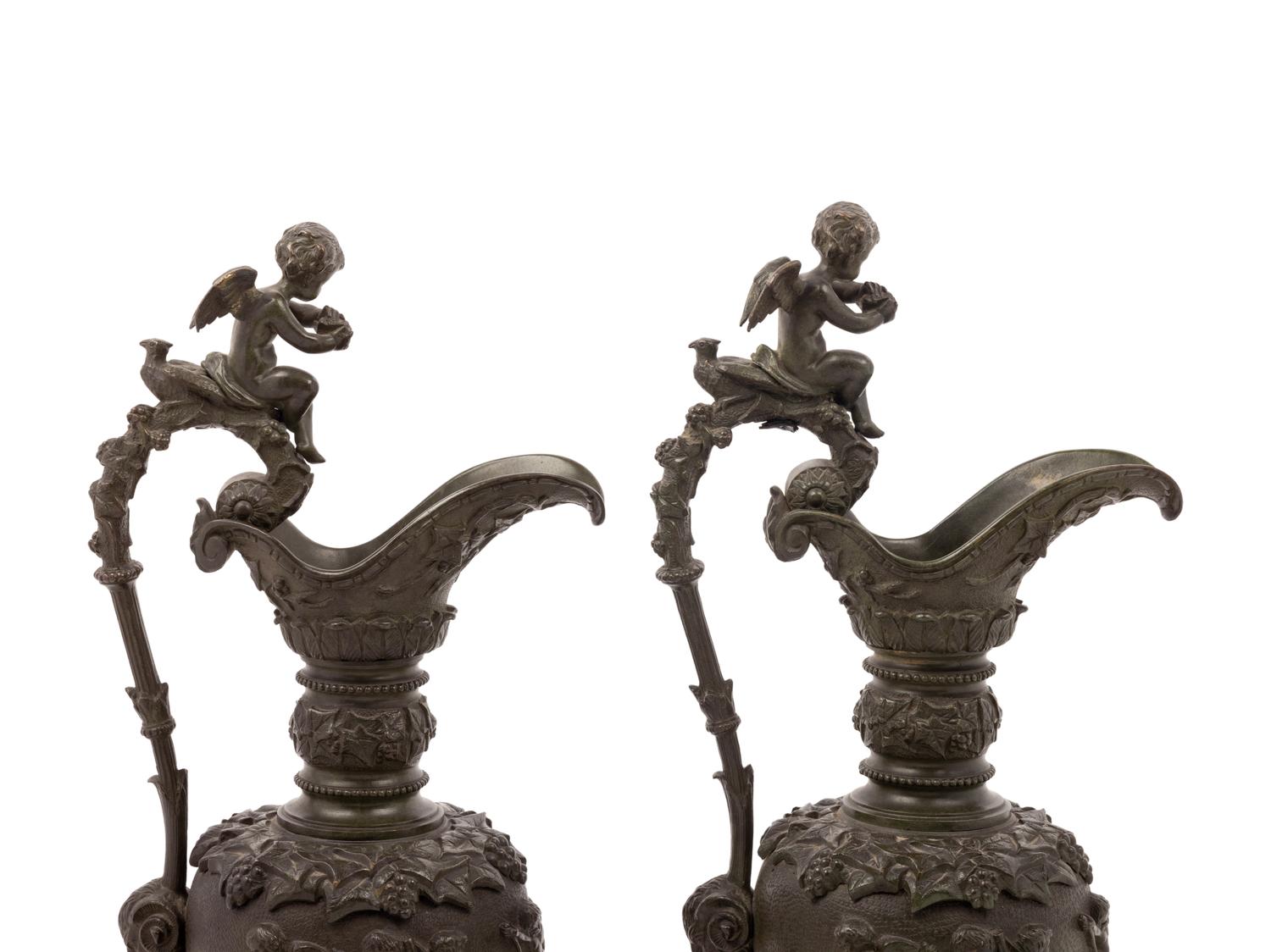 A Pair of Neoclassical Patinated Bronze Ewers with Bacchic Putti