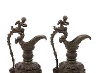 A Pair of Neoclassical Patinated Bronze Ewers with Bacchic Putti