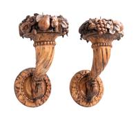A Pair of Continental Carved Fruitwood Sconces