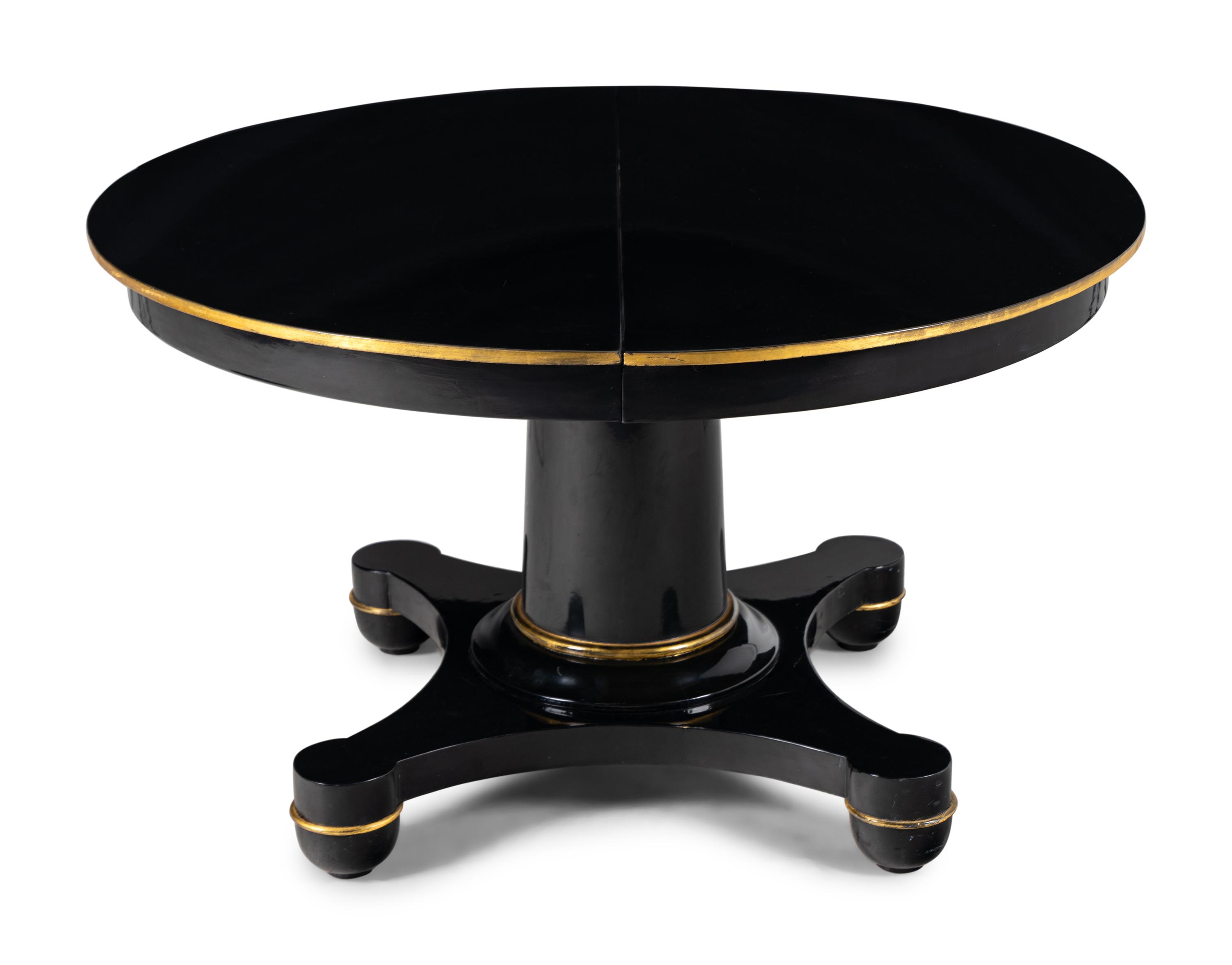 A Biedermeier Black Painted and Parcel-Gilt Pedestal Dining Table