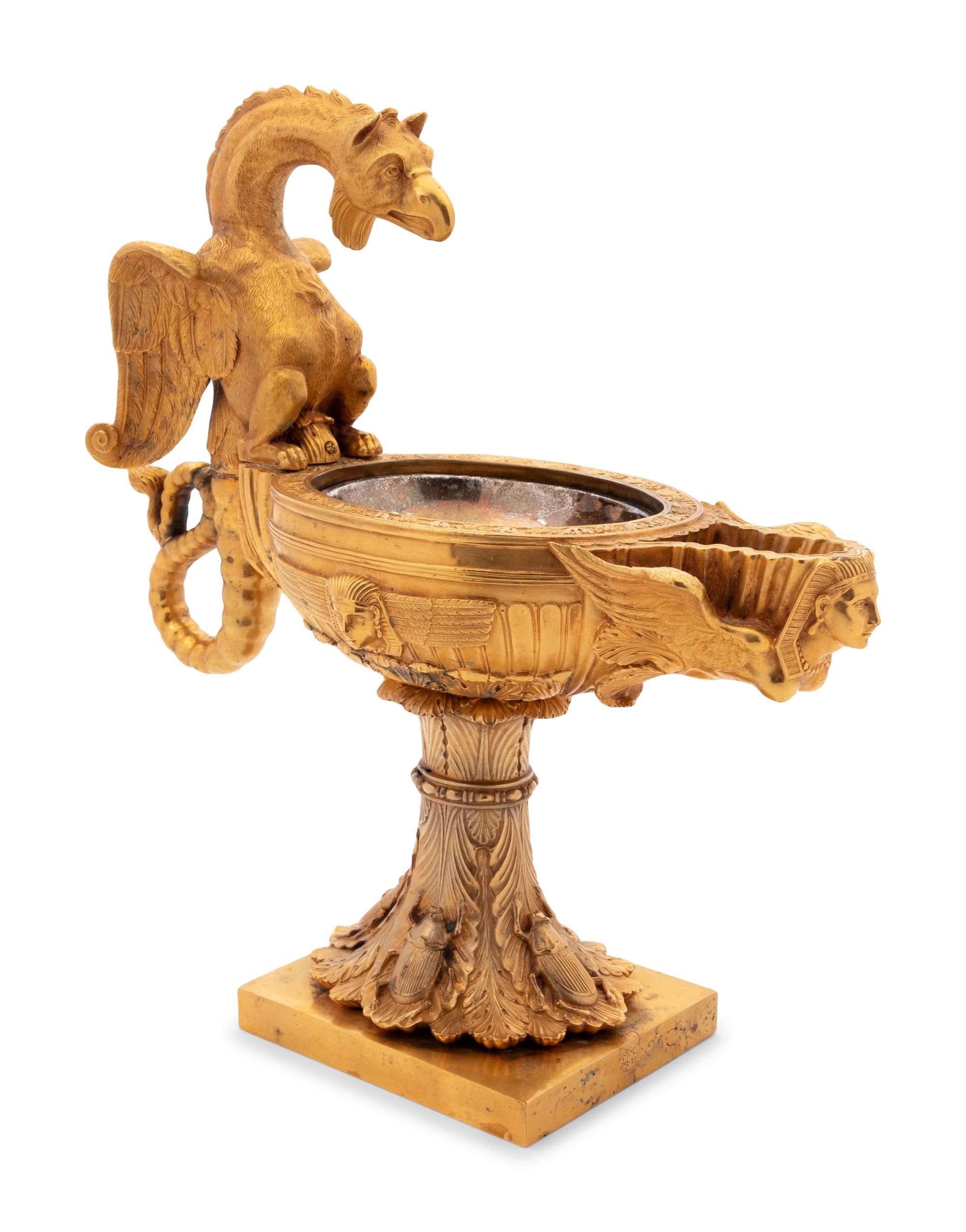 A Continental Gilt Bronze Oil Lamp with a Dragon Handle