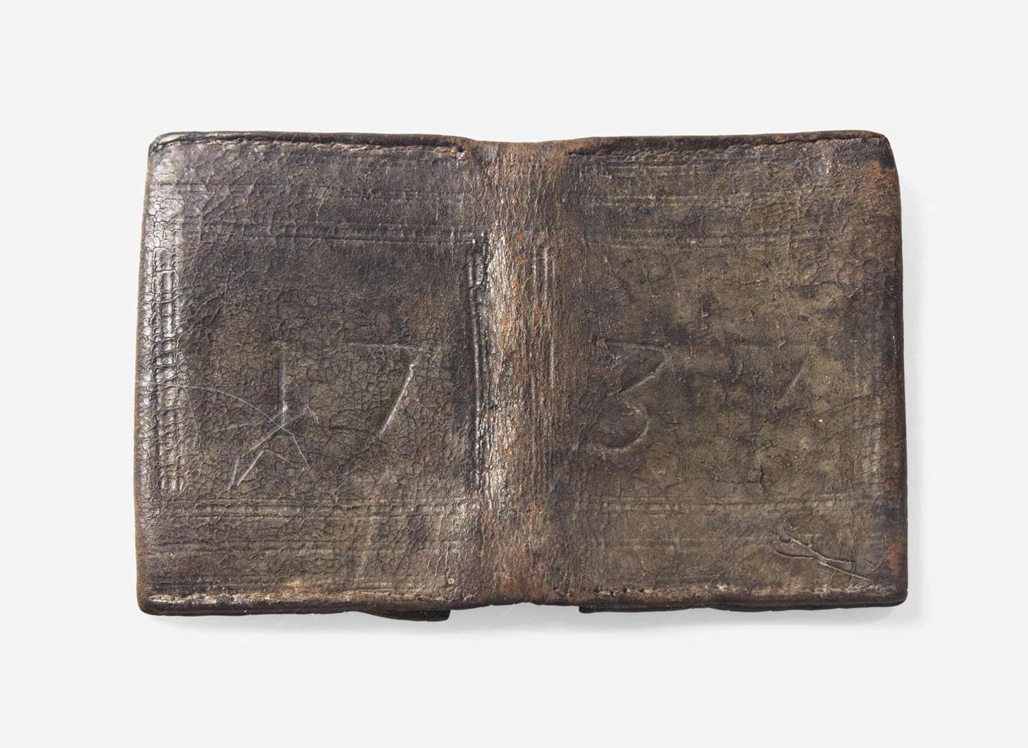 A tooled, dated and initialed leather pocketbook, belonging to Robert Morris, Sr. (1711-1750) and Robert Morris, Jr. (1734-1806), dated "1737"