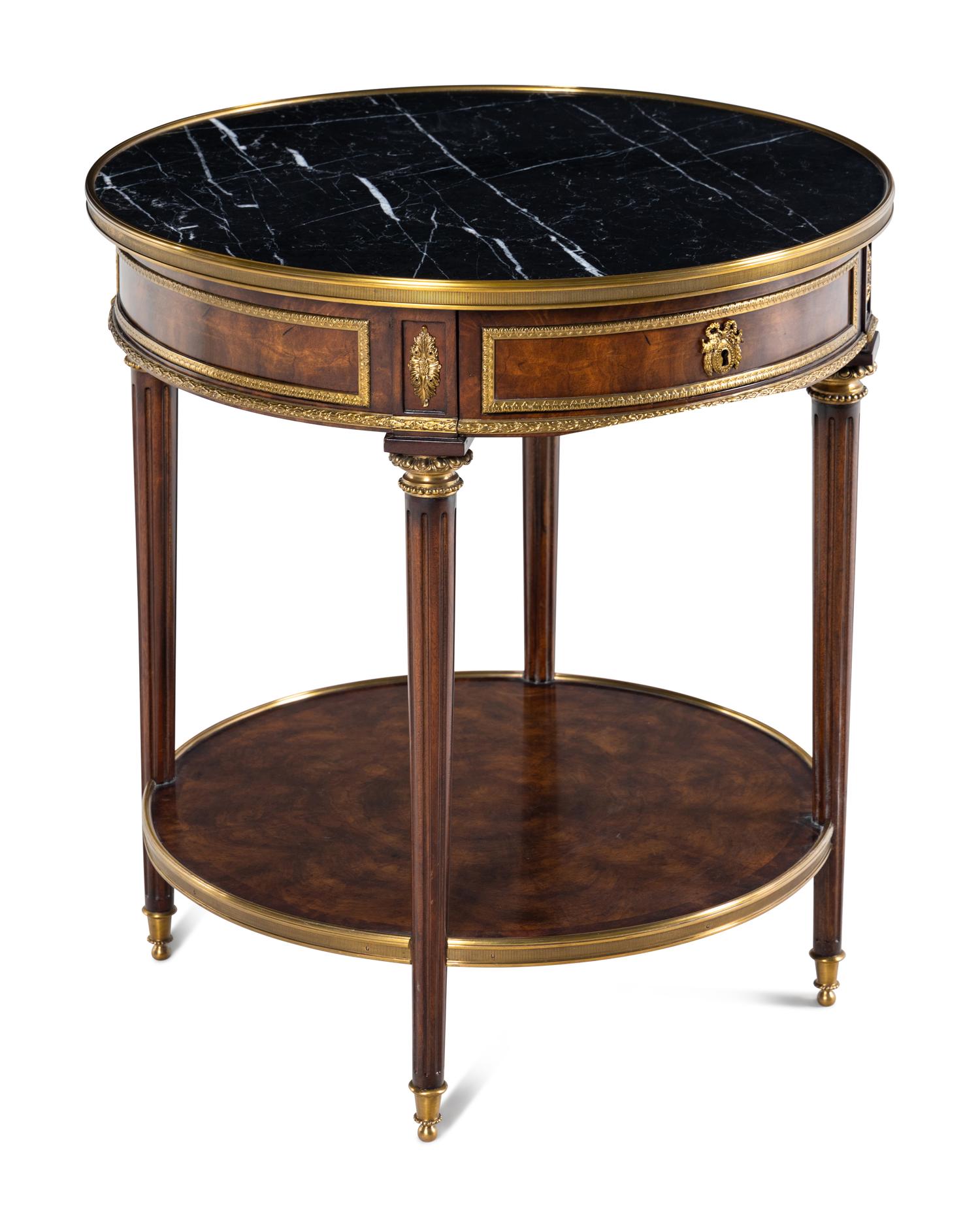 A Louis XVI Style Gilt Metal Mounted Marble-Top Mahogany Guéridon