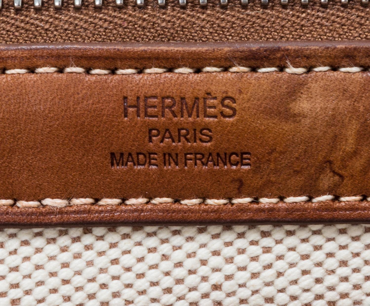 An Hermes Ecru Toile and Veau Barenia Mira Tote Bag, 14" x 14" x 5.5".