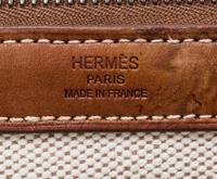 An Hermes Ecru Toile and Veau Barenia Mira Tote Bag, 14" x 14" x 5.5".