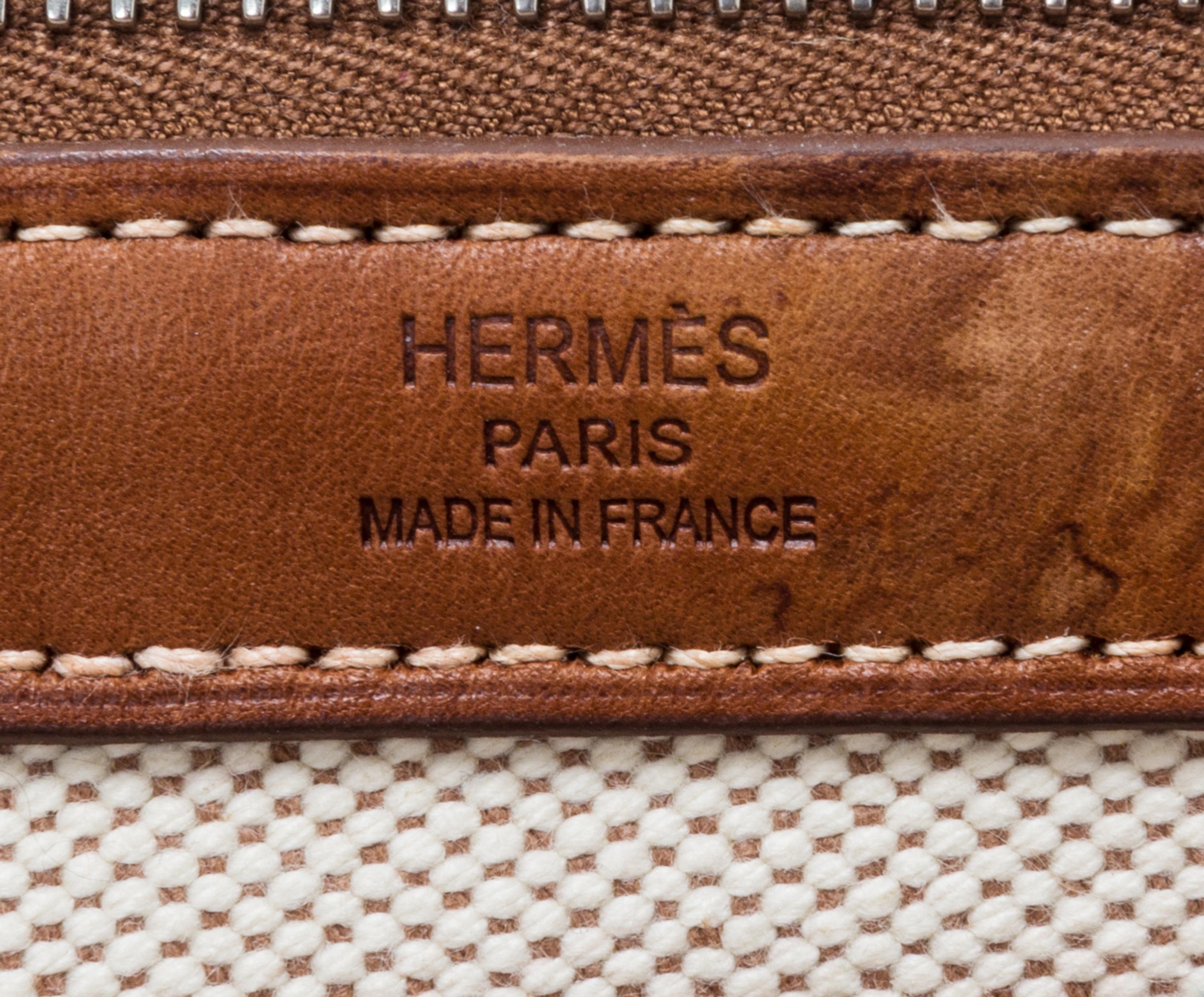 An Hermes Ecru Toile and Veau Barenia Mira Tote Bag, 14" x 14" x 5.5".