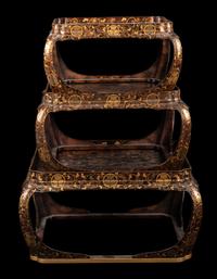 A Set of Three Japanese Gilt Decorated Lacquer Nesting Tables