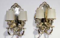 A Pair of Baroque Style Silver-Plated Metal Two-Light Wall Sconces Height 15 inches.