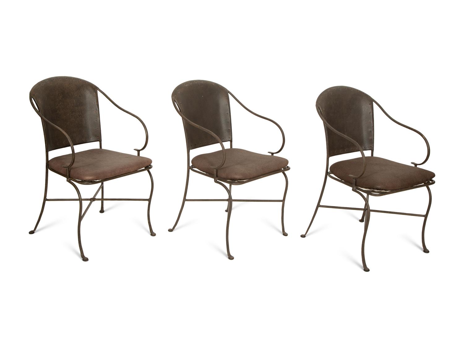 A Set of Seven Patinated Metal Dining Chairs