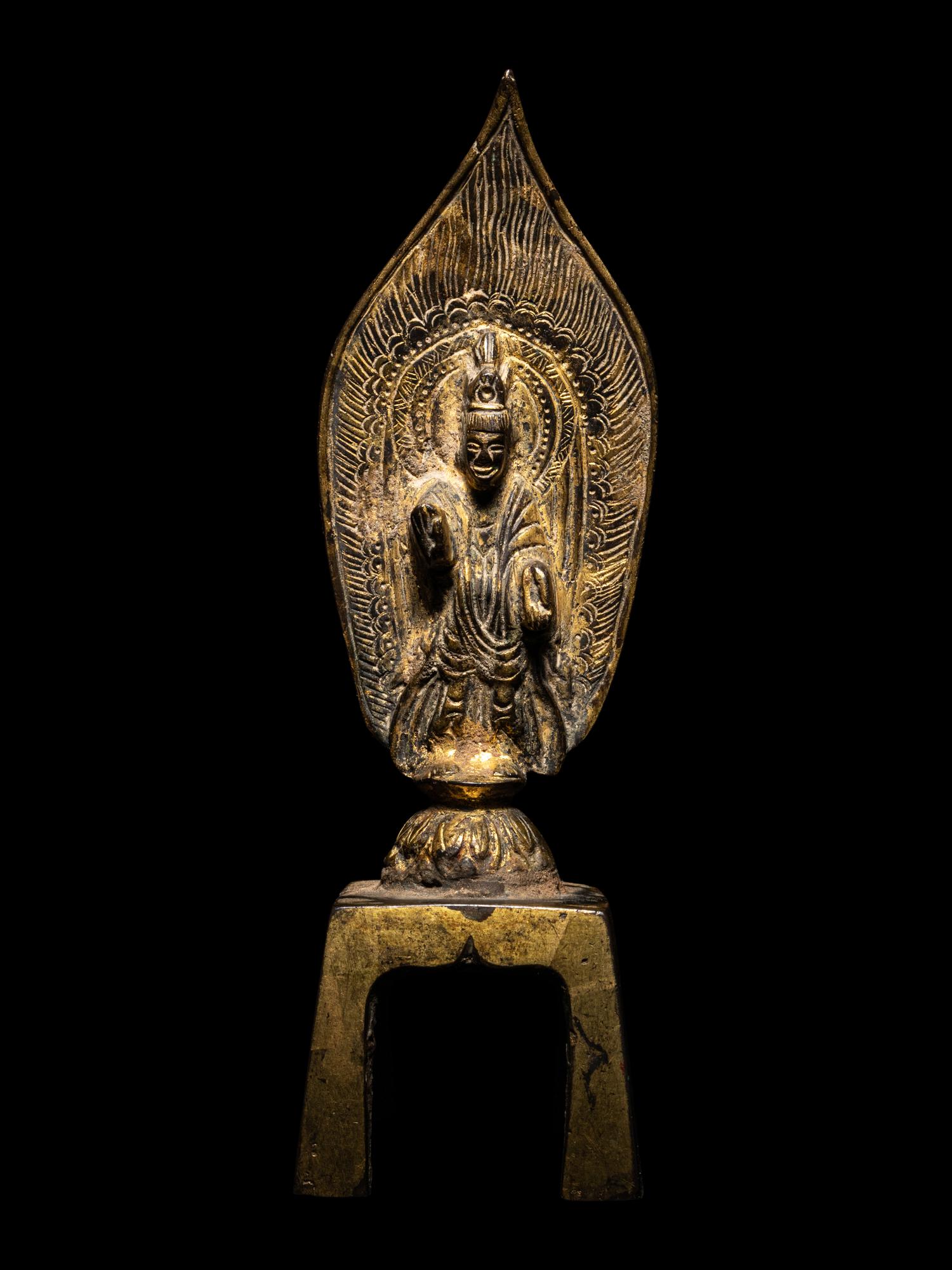 A Gilt Bronze Votive Figure of Standing Buddha