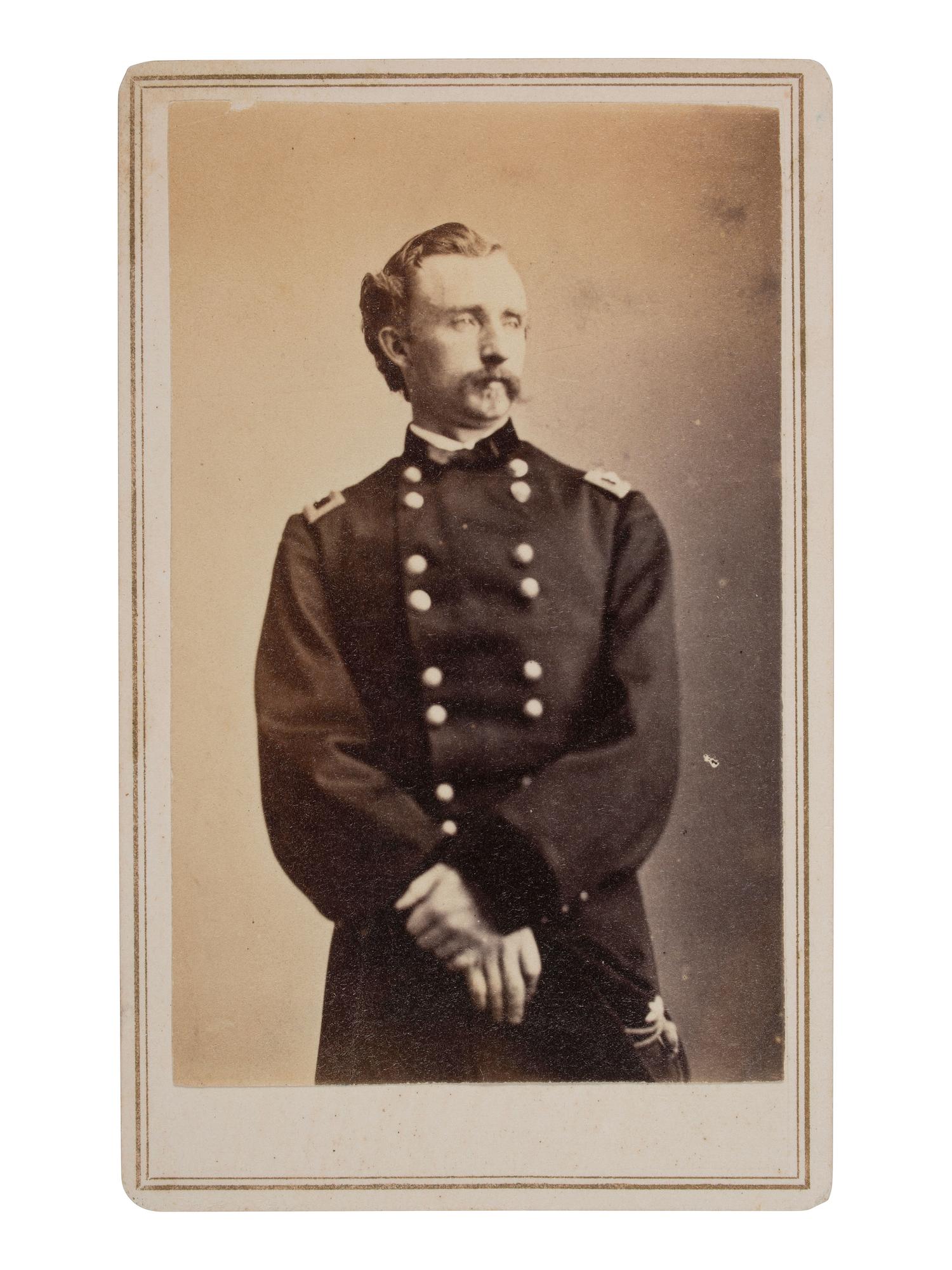 [CUSTER, George Armstrong (1839-1876)]. CDV standing portrait of Custer as brigadier general. Ca 1864.