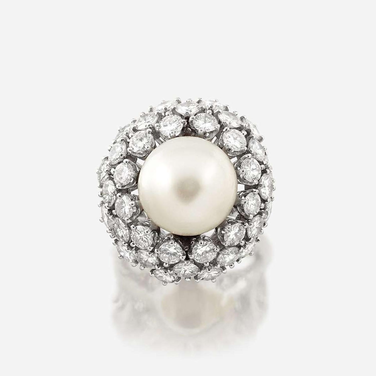 A cultured pearl, diamond, and eighteen karat white gold ring