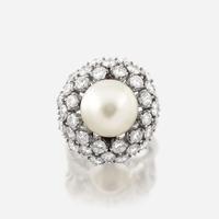 A cultured pearl, diamond, and eighteen karat white gold ring