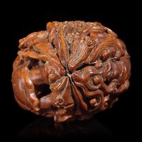 A Chinese Carved Luohan Walnut, 19th/Early 20th Century — 晚清/民國 羅漢圖文玩核桃