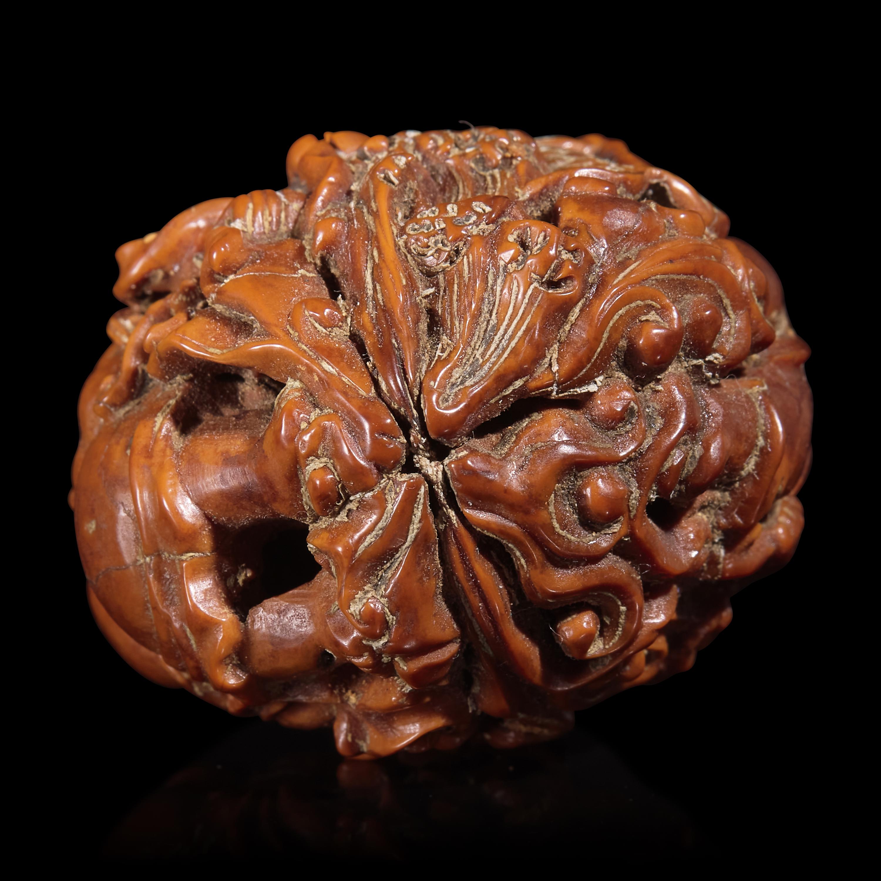 A Chinese Carved Luohan Walnut, 19th/Early 20th Century — 晚清/民國 羅漢圖文玩核桃