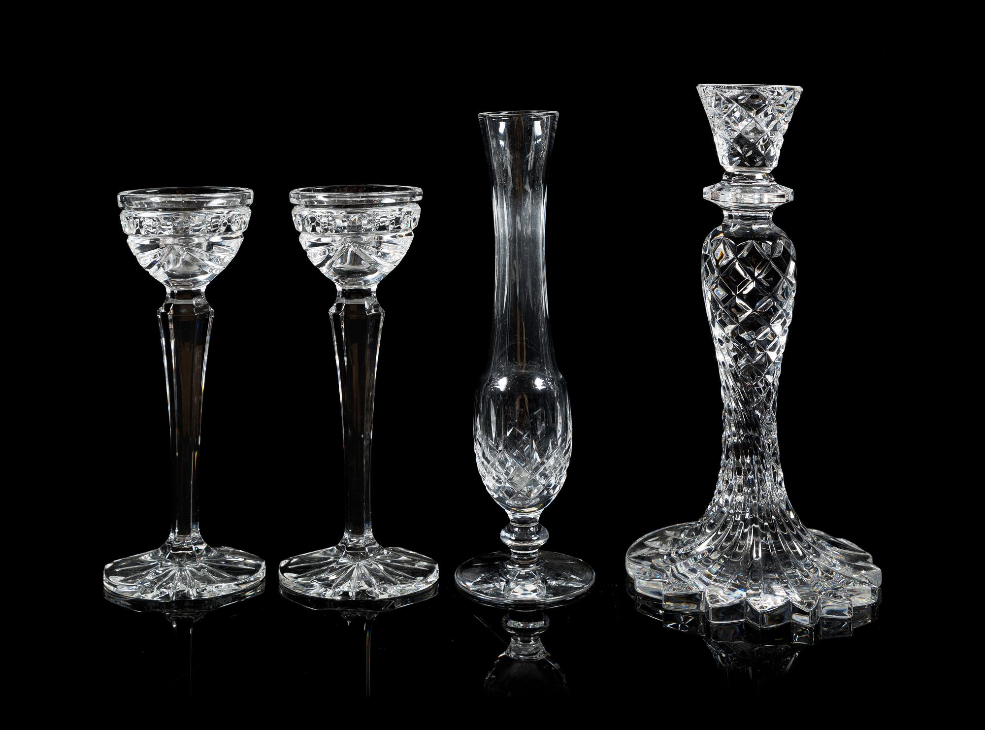 Waterford, a group of three crystal candlesticks, comprising a pair and a single, together with a bud vase