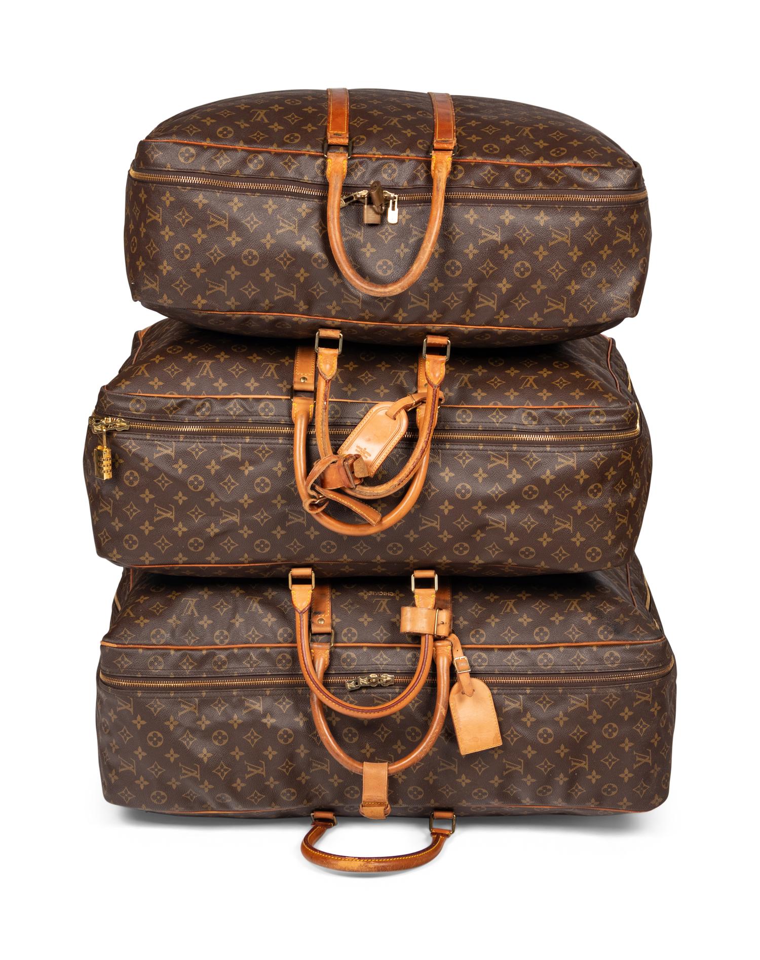 A Group of Three Louis Vuitton Soft-Sided Suitcases, 20th Century