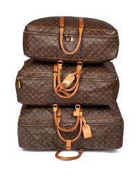 A Group of Three Louis Vuitton Soft-Sided Suitcases, 20th Century
