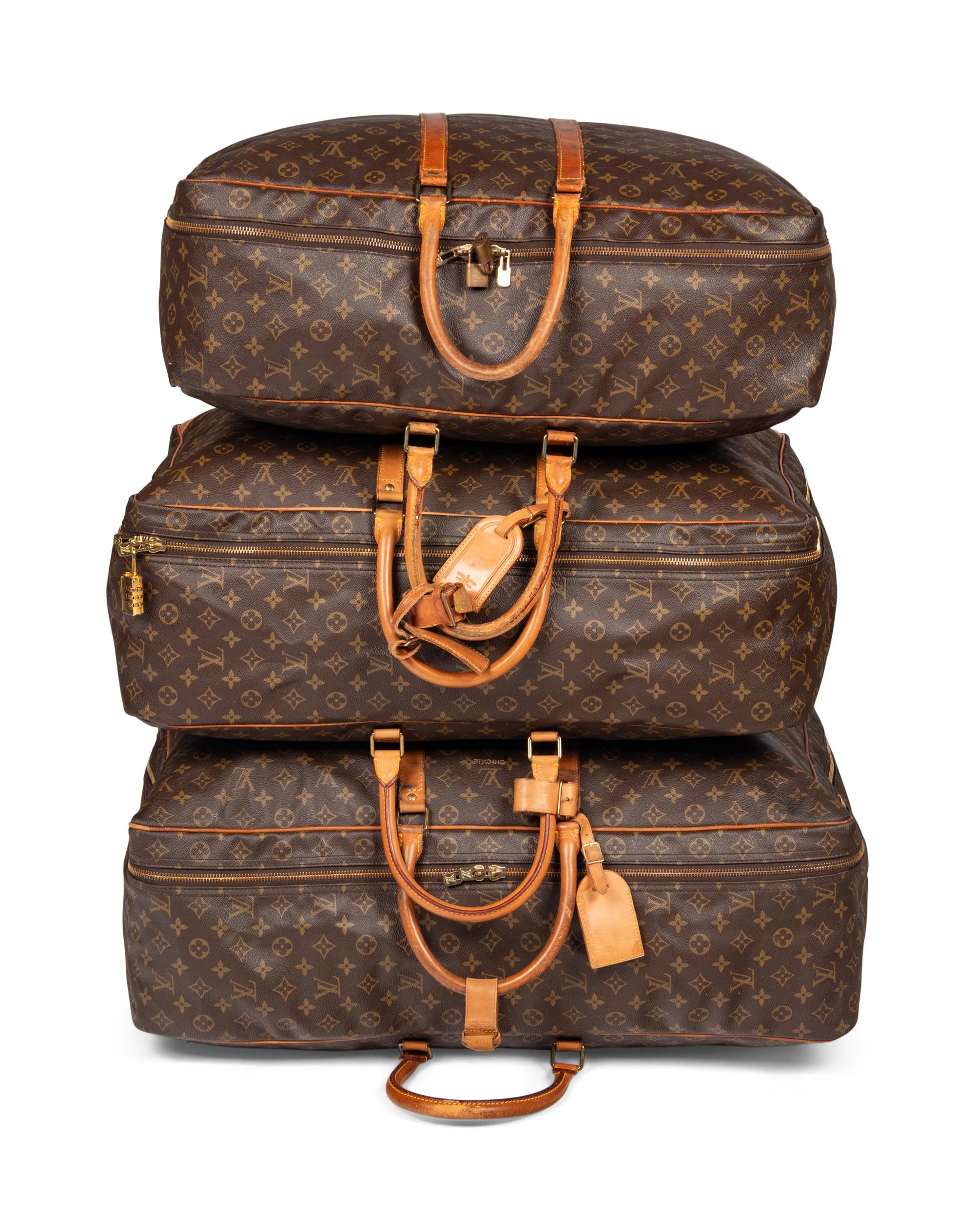 A Group of Three Louis Vuitton Soft-Sided Suitcases, 20th Century