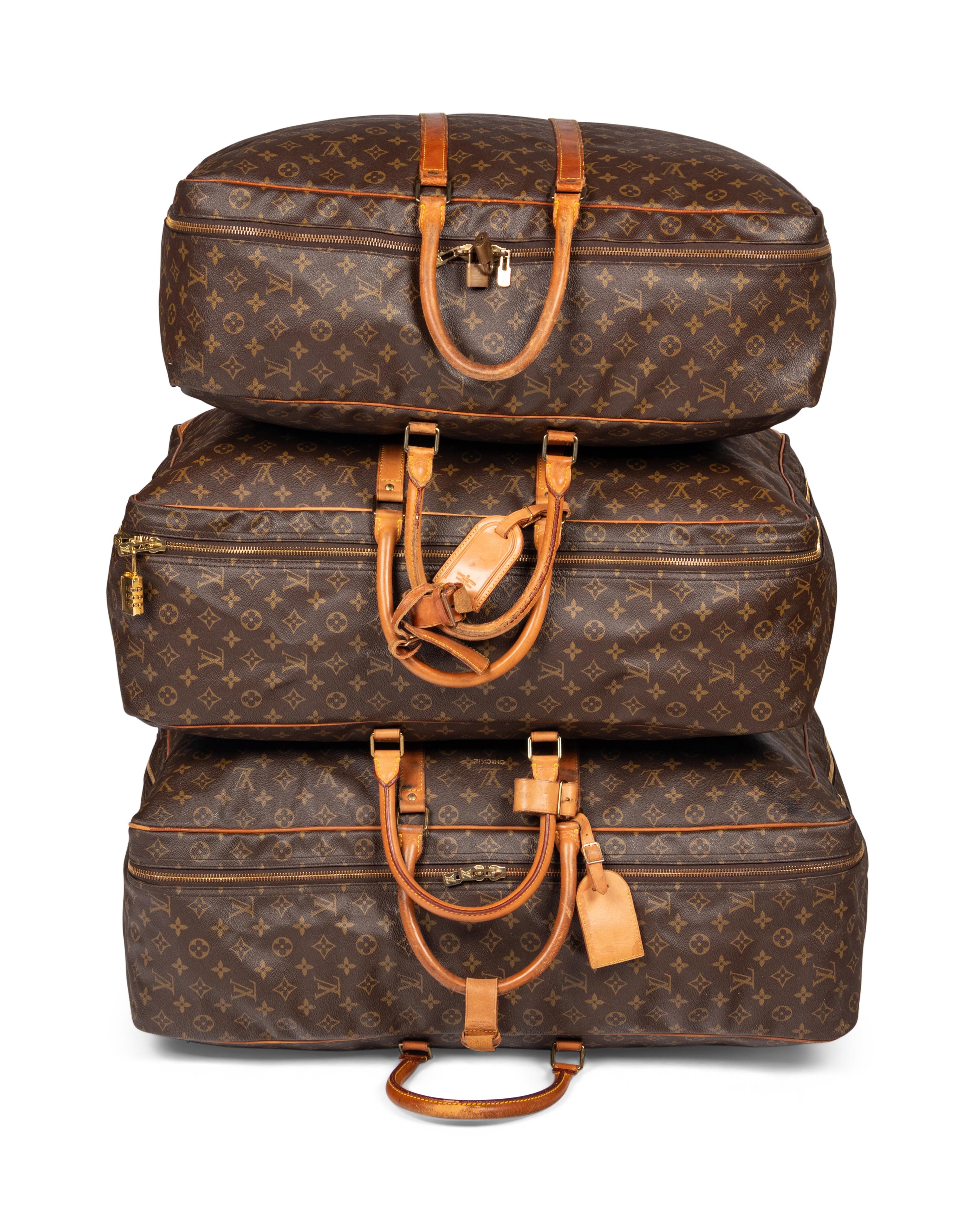 A Group of Three Louis Vuitton Soft-Sided Suitcases, 20th Century