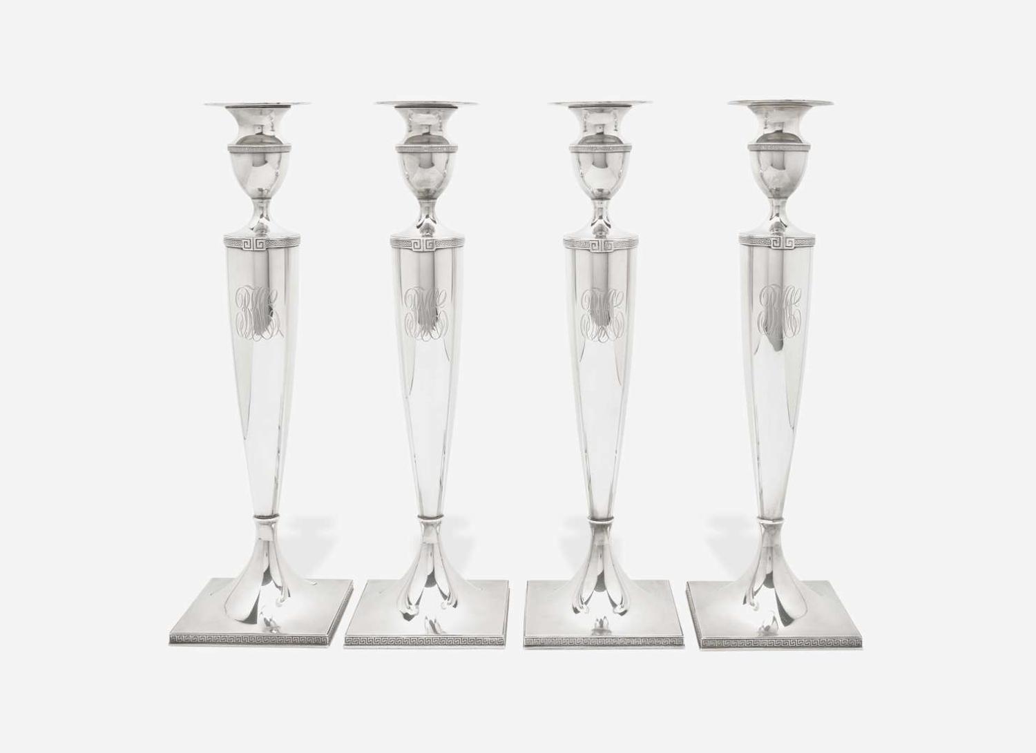 A set of four Neoclassical weighted sterling silver candlesticks, Gorham Mfg. Co, Providence, RI, bearing date mark for 1917