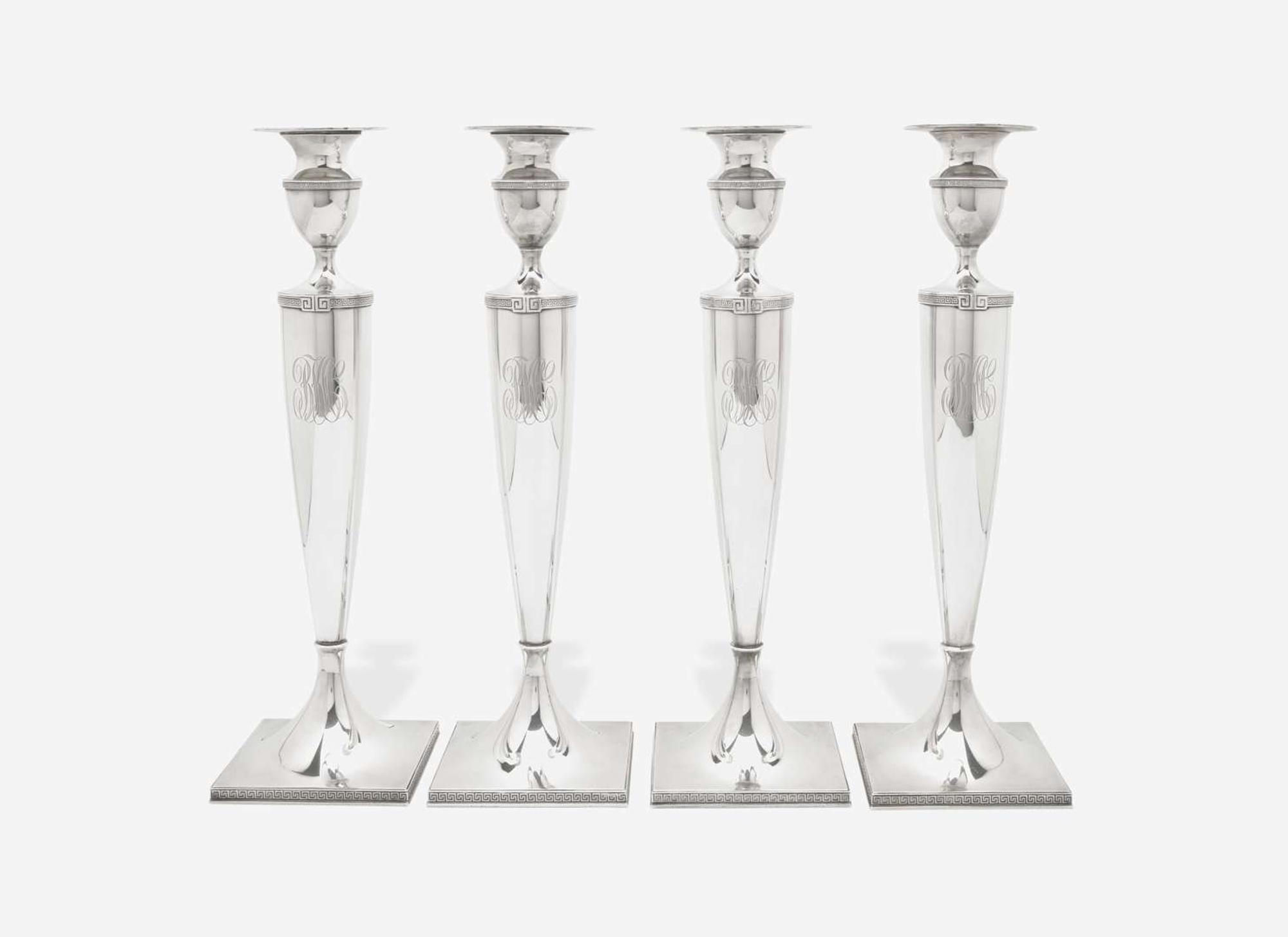 A set of four Neoclassical weighted sterling silver candlesticks, Gorham Mfg. Co, Providence, RI, bearing date mark for 1917