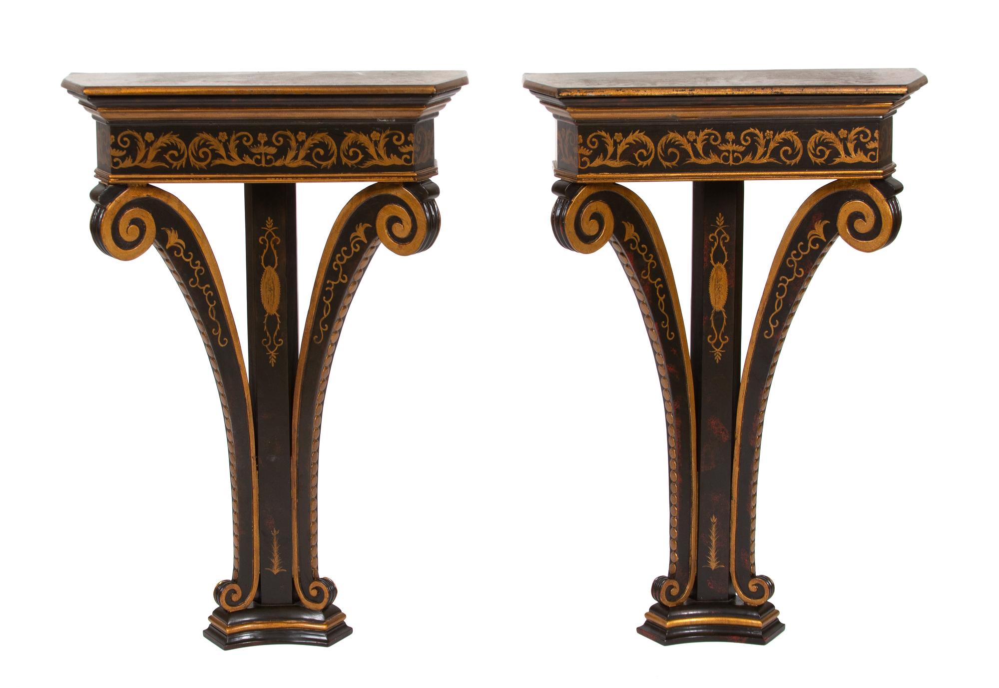 A Pair of Regency Style Black and Gilt Decorated Demilune Wall Mounted — 20TH CENTURY