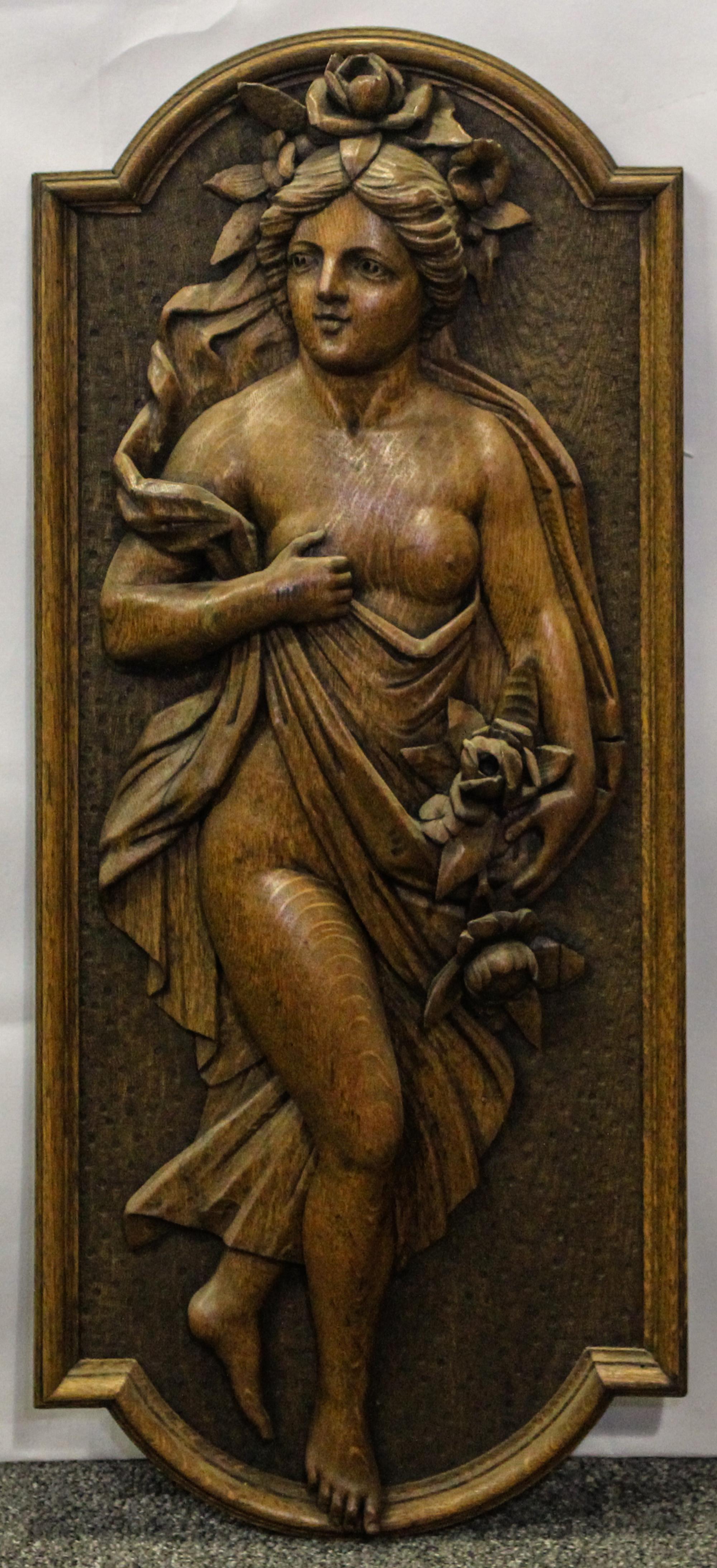 A Carved Oak Relief Panel. Height 33 inches.