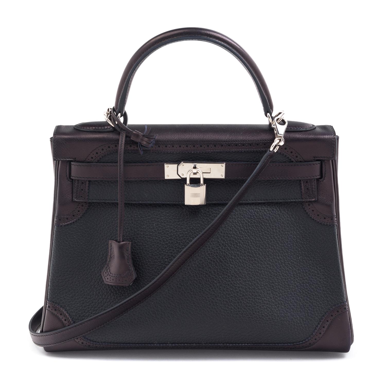 An Hermes Bicolor Noir and Bleu Indigo Swift and Taurillon Clemence 32cm Kelly Ghillies Handbag, 13" x 9.5" x 4.5".
