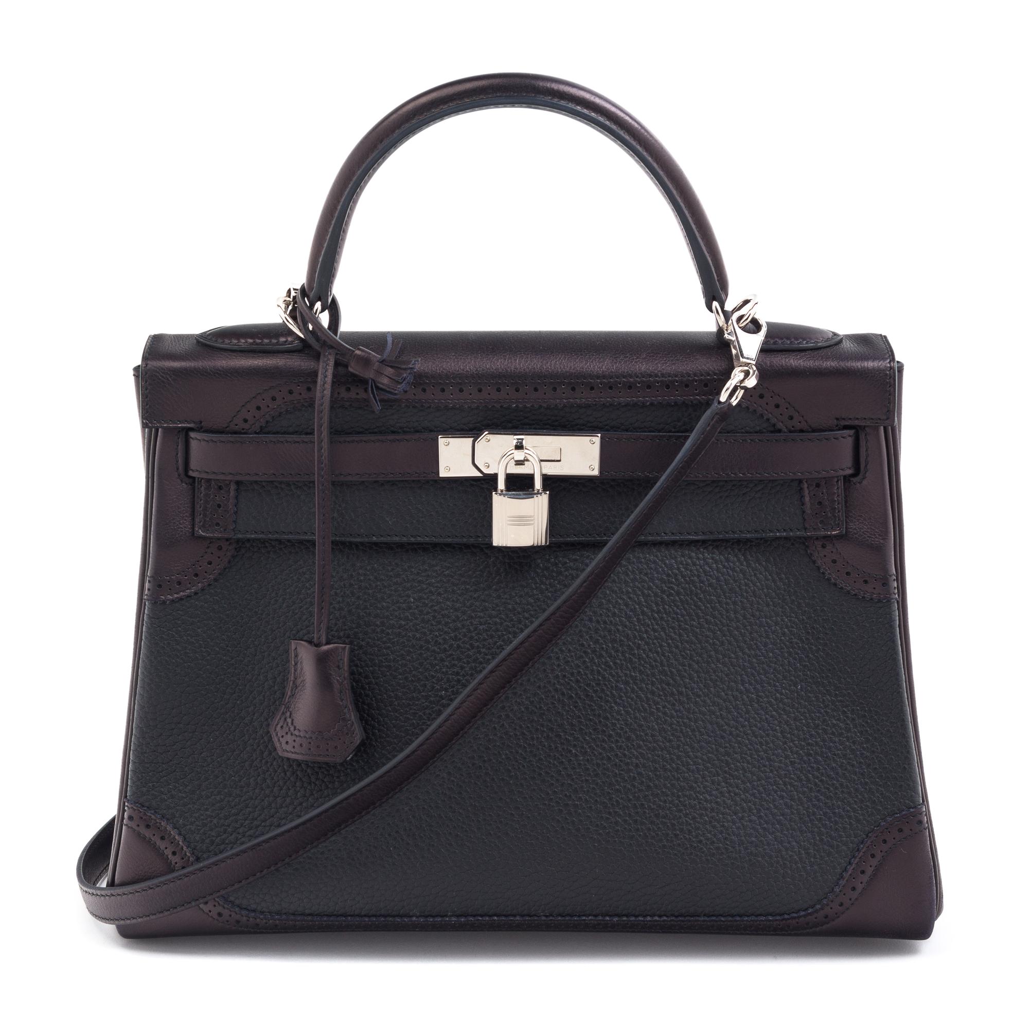An Hermes Bicolor Noir and Bleu Indigo Swift and Taurillon Clemence 32cm Kelly Ghillies Handbag, 13" x 9.5" x 4.5".