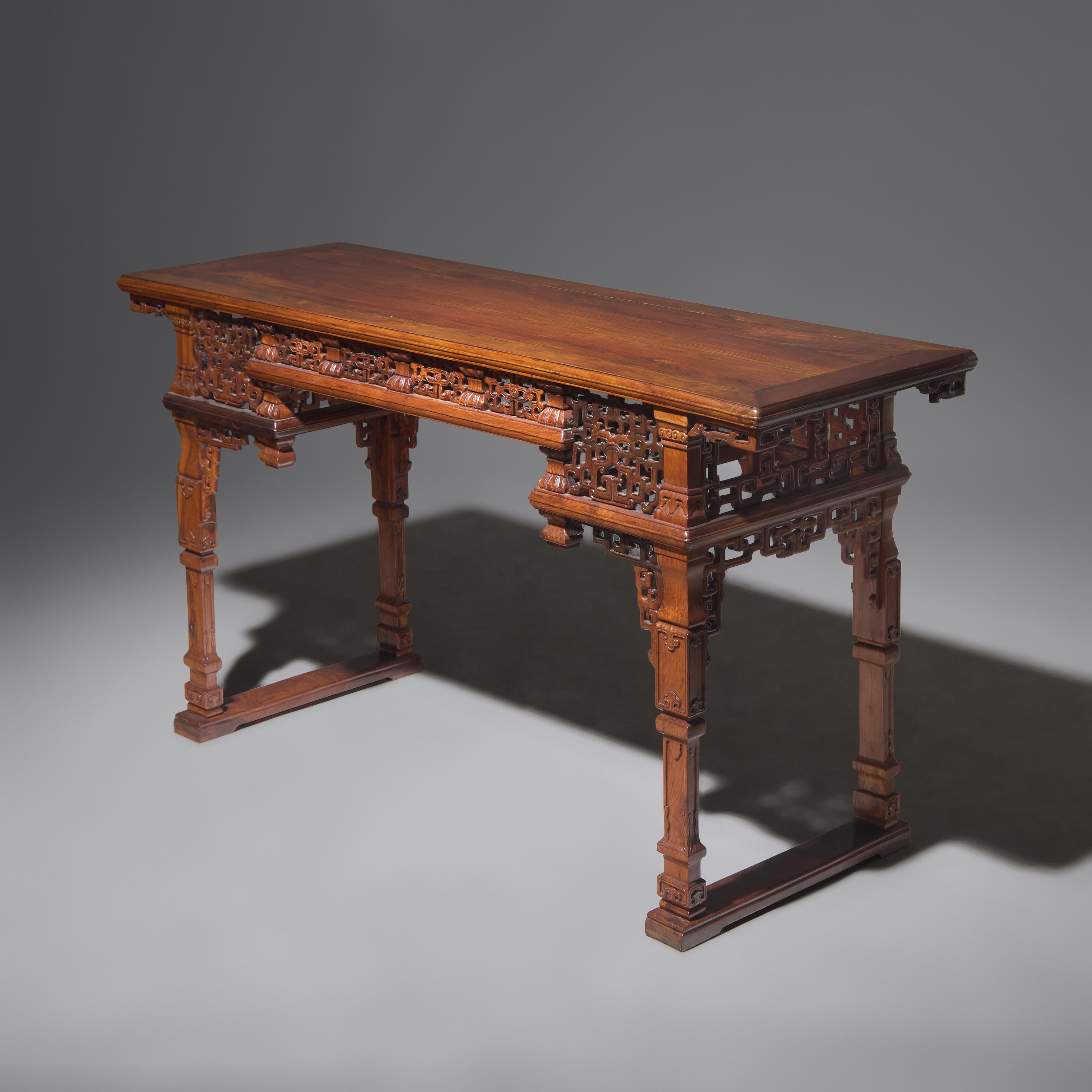 A Chinese Carved Huanghuali Side Table, Tiaozhuo, Late 19th to 20th Century 晚清民國 黃花梨透雕夔龍紋條桌
