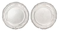 A Pair of George III Silver Dinner Plates, Probably William Stroud, London, 1802, each of shaped circular form with a gadrooned rim, bo