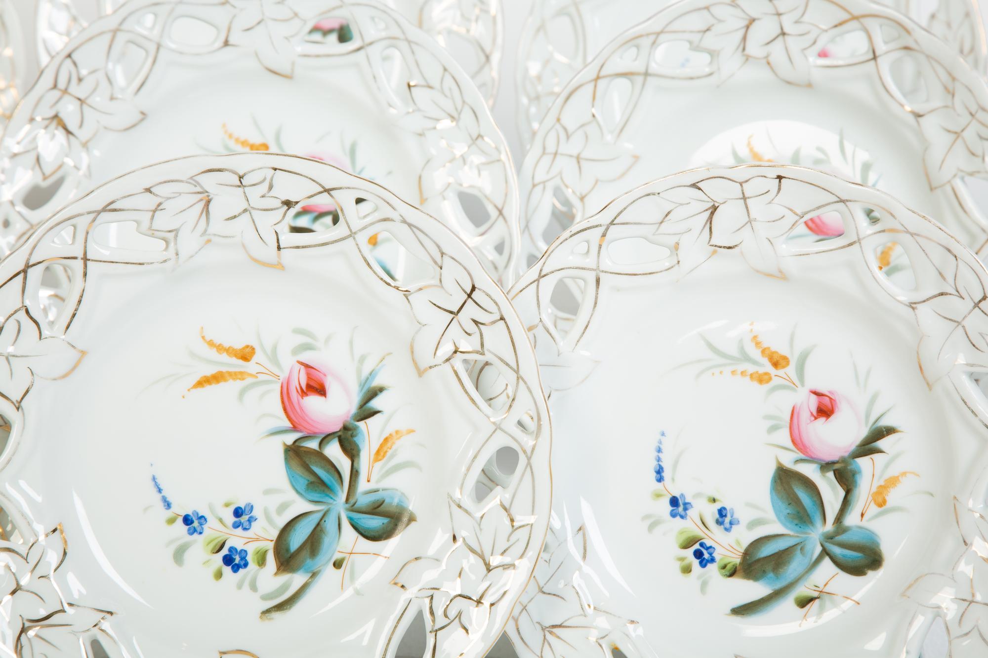 Nine English Porcelain Luncheon Plates and Five Continental Porcelain Cups with Saucers