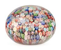 A Baccarat Close Packed Millefiori and Silhouette Glass Paperweight