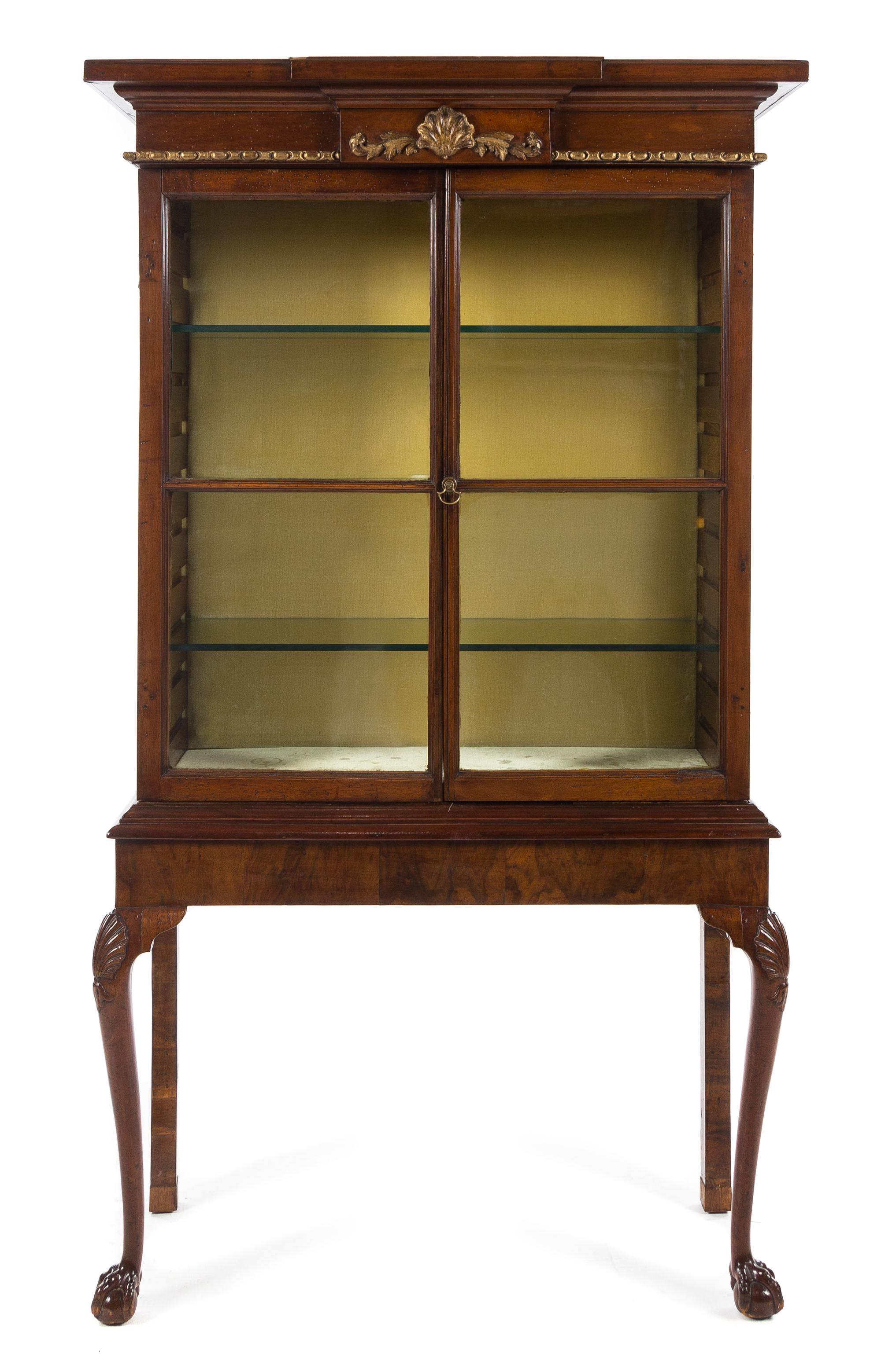 A Queen Anne Style Parcel Gilt Mahogany Vitrine Cabinet Height 70 x width 37 1/4 x depth 14 3/4 inches. — 19TH CENTURY