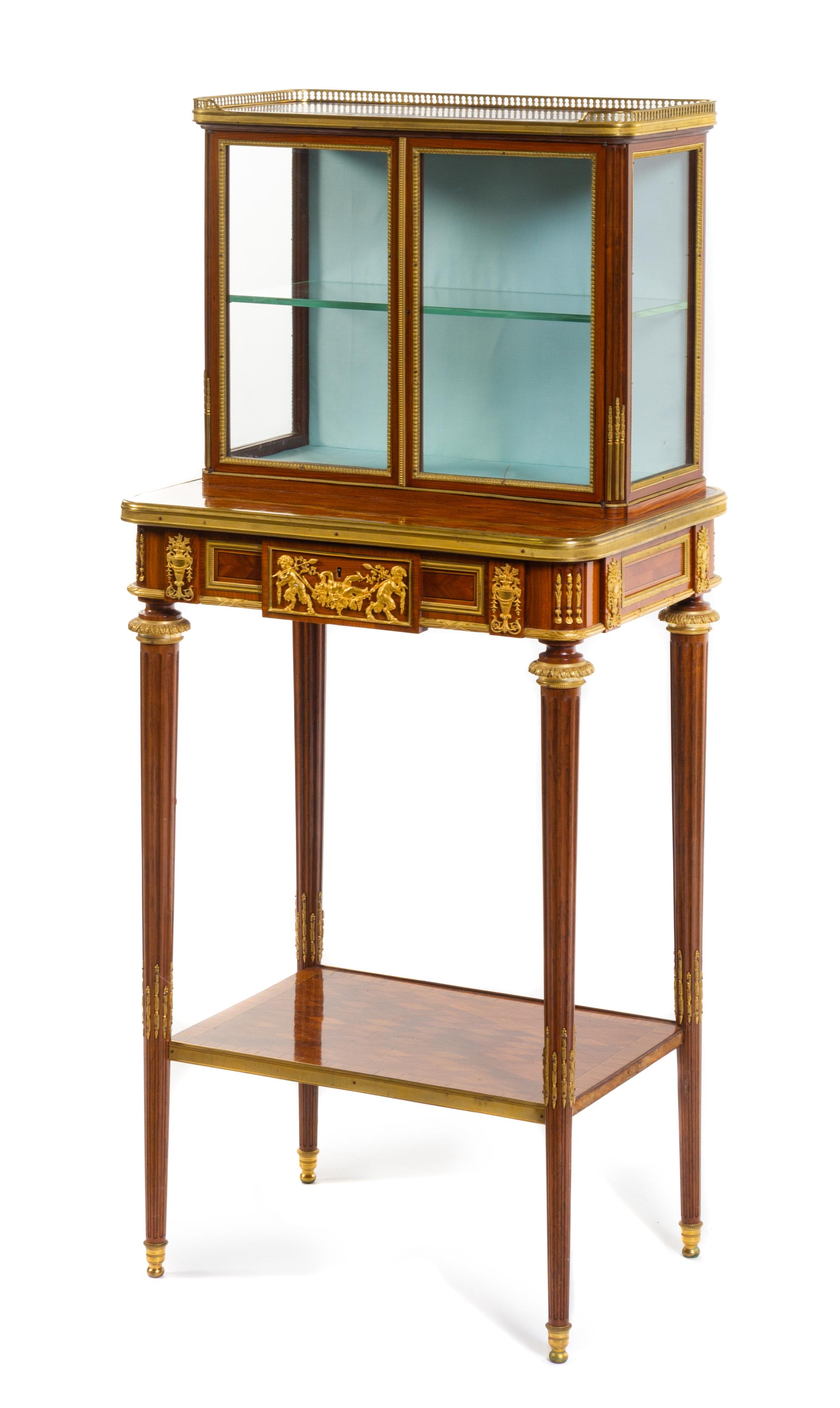 A Louis XVI Style Gilt Bronze Mounted Parquetry Vitrine Cabinet Height 46 3/4 x width 20 3/4 x depth 15 inches. — VICTOR RAULIN, PARIS, THIRD QUARTER 19TH CENTURY