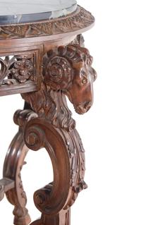 An Italian Carved Walnut Marble-Top Table