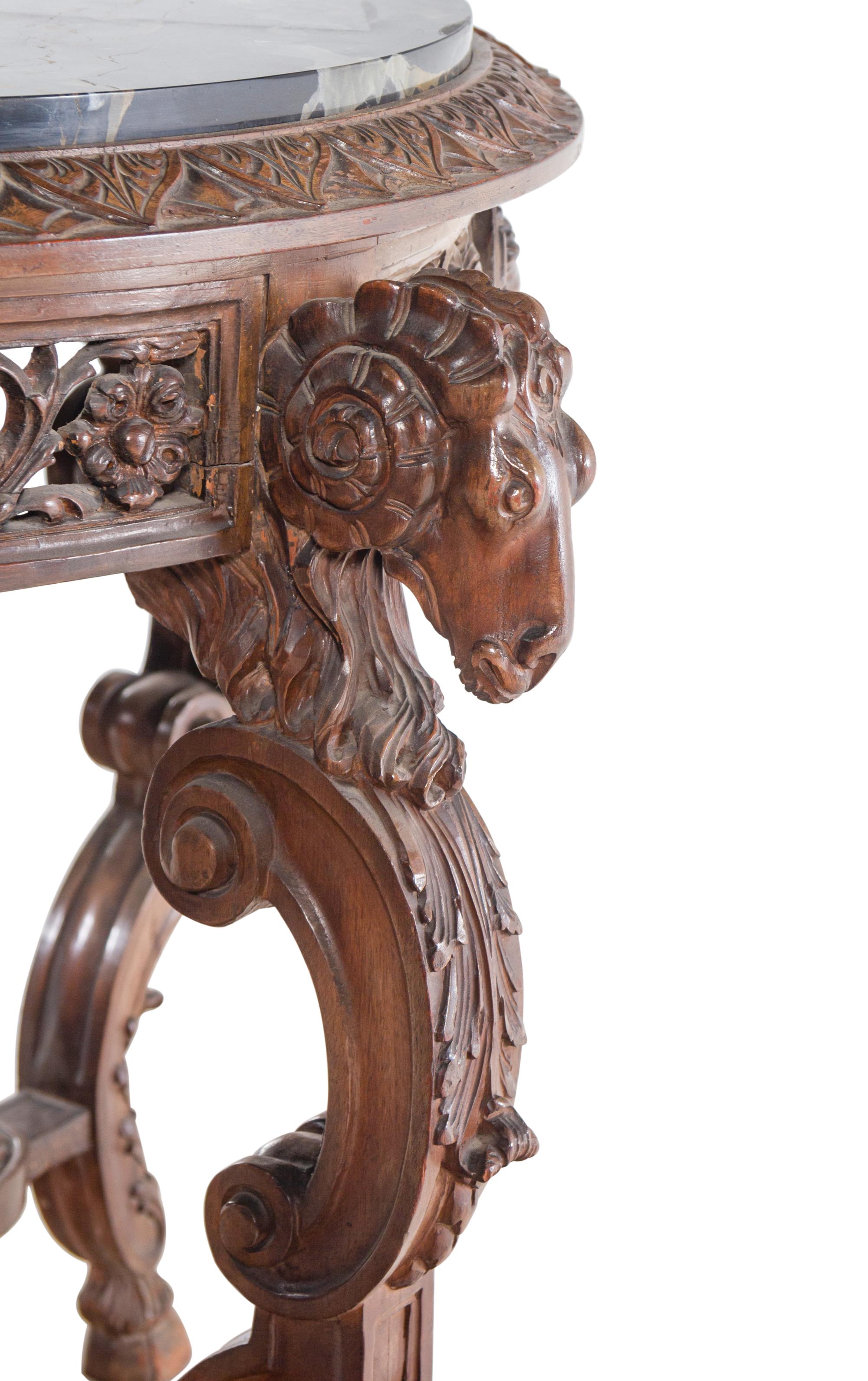 An Italian Carved Walnut Marble-Top Table