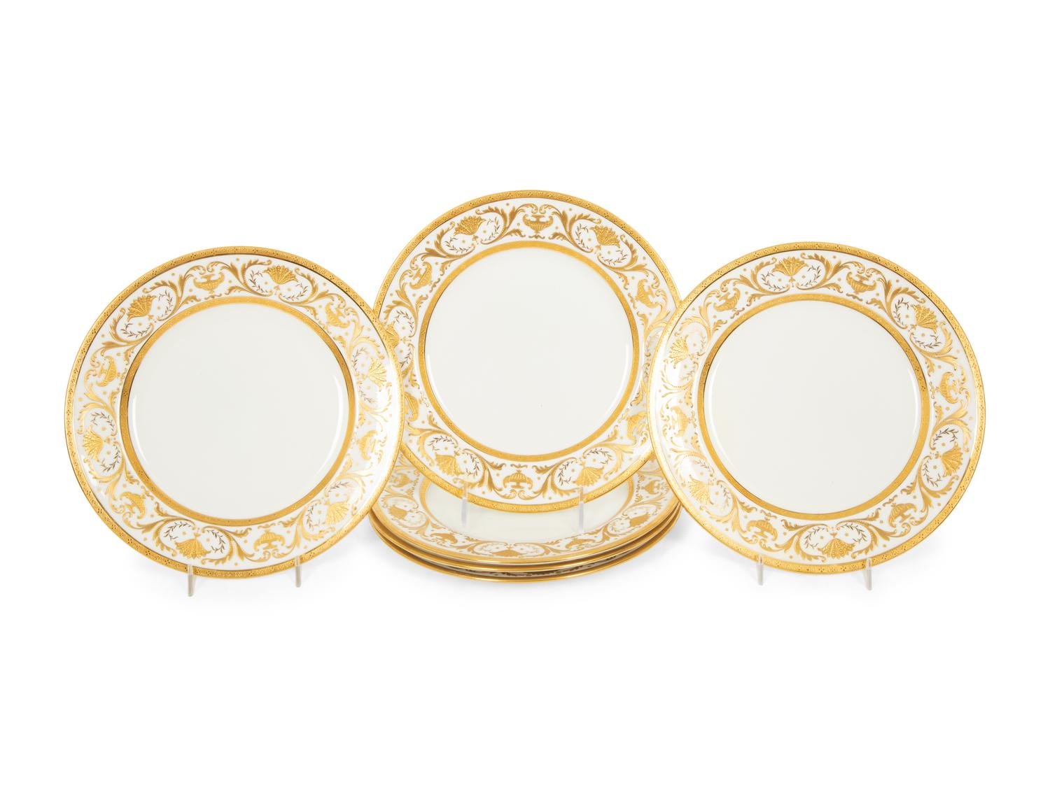 Two Sets of Gilt Decorated Porcelain Dinner Plates
