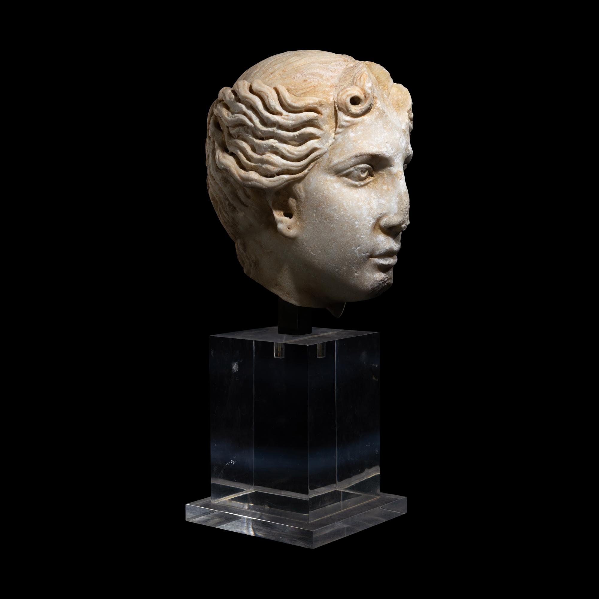 A Roman Marble Head of a Goddess