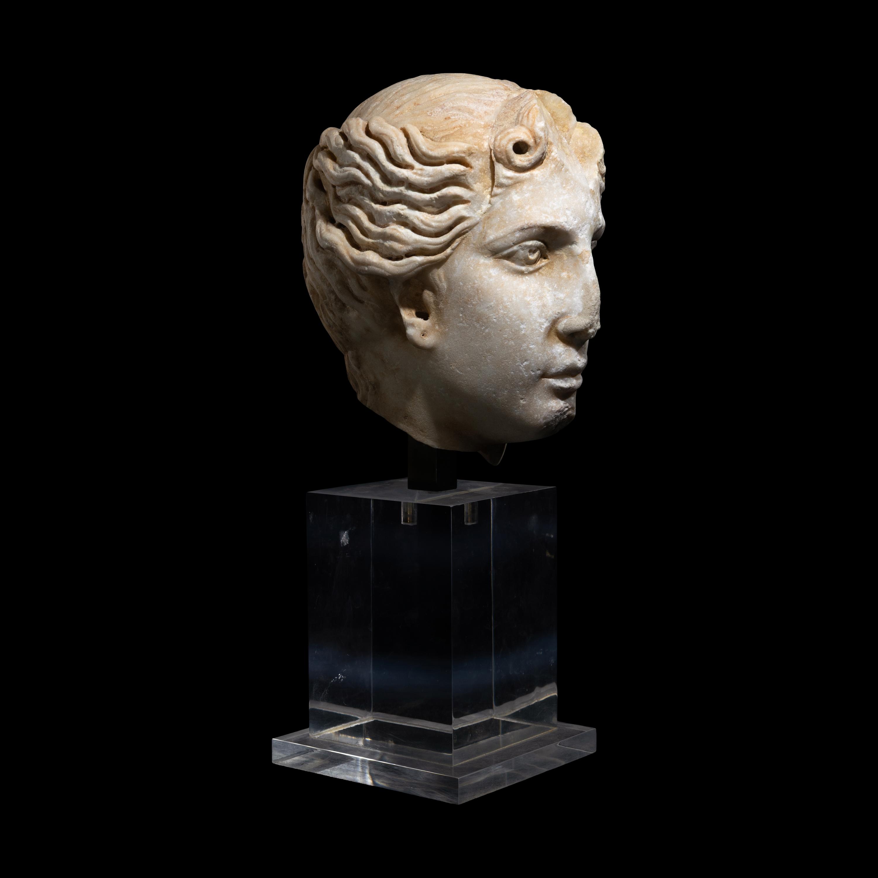 A Roman Marble Head of a Goddess