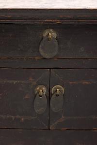 A Chinese Carved and Black Painted Wood Diminutive Chest