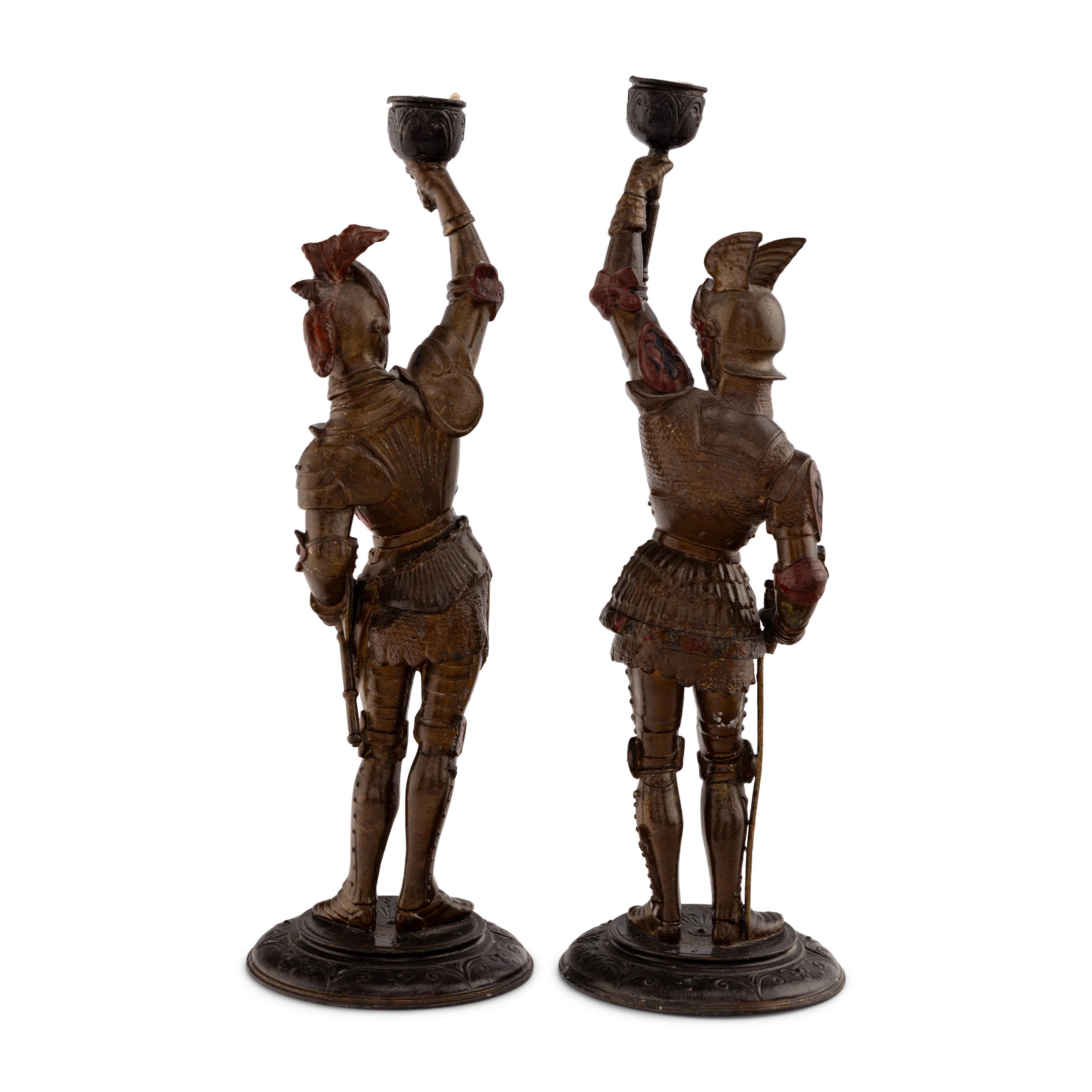 A Pair of Cold Painted Cast Metal Figural Candlesticks