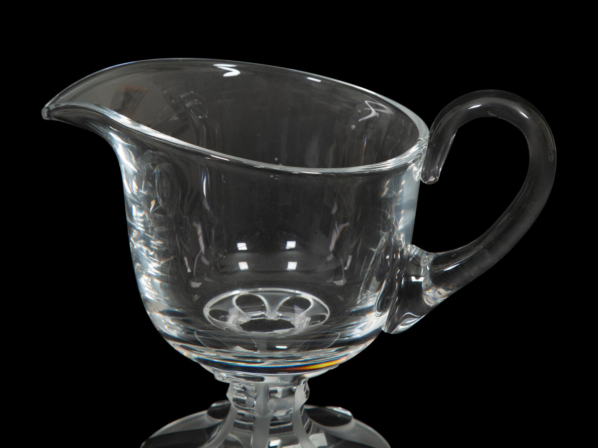 A Lalique Clear Glass Pitcher and an Orrefors Footed Bowl