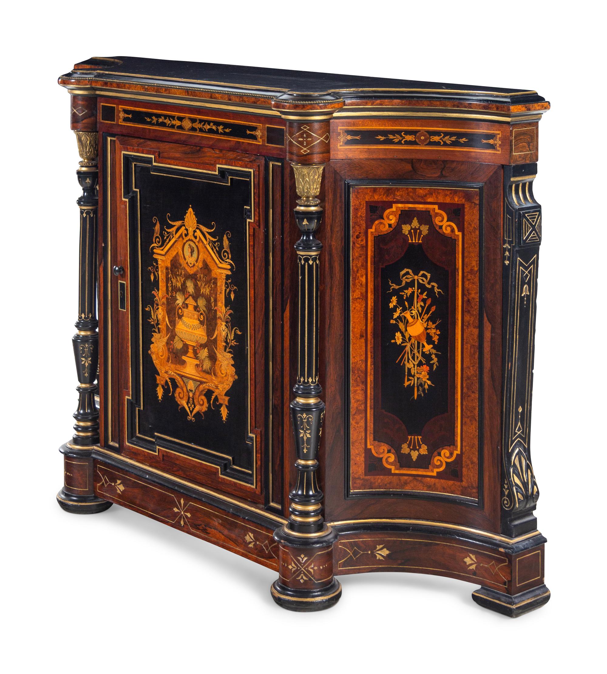 A Victorian Parcel Gilt Ebonized and Inlaid Rosewood Parlor Cabinet