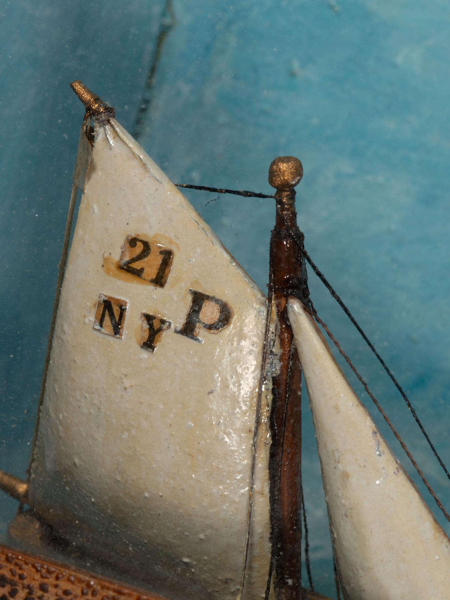A Carved and Painted Wood Ship Diorama