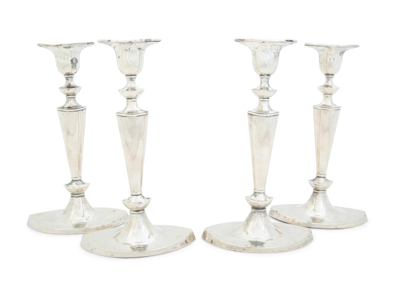 Four English Silver Weighted Candlesticks