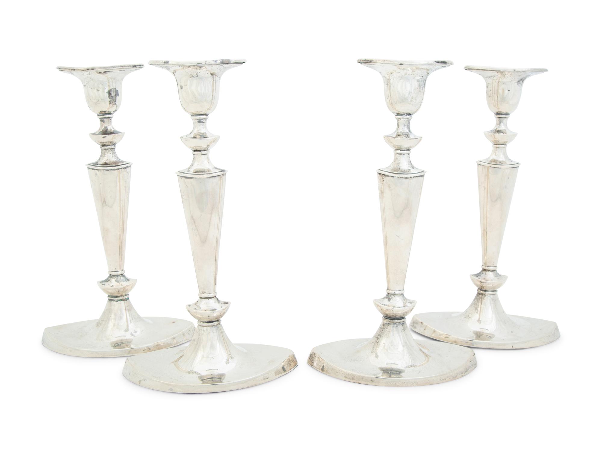 Four English Silver Weighted Candlesticks