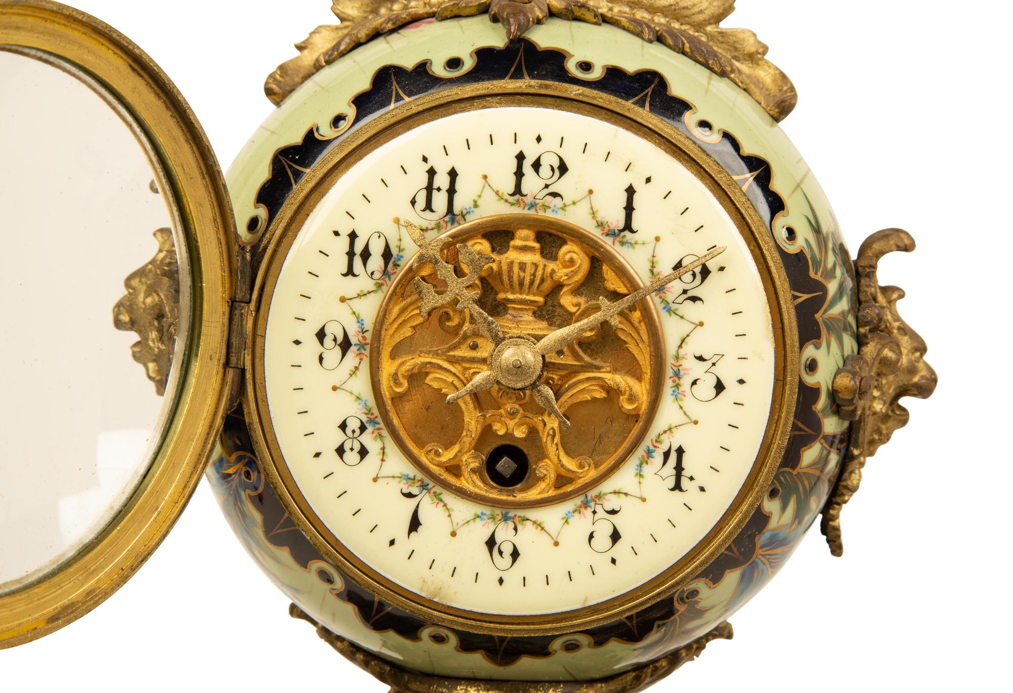 A French Gilt Bronze and Glazed Pottery Clock — LATE 19TH CENTURY